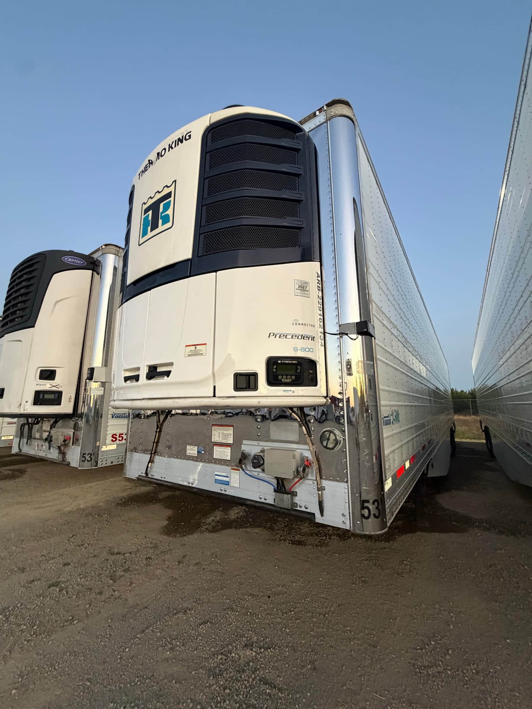 Refrigerated trailer number 53 in a row of reefers on the FleetWay yard at dusk